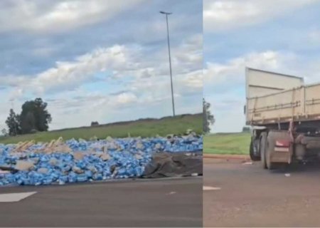 Tampa abre e carga de cerveja cai de carreta em Dourados (vídeo)